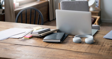 Modern home office setup featuring ergonomic chair, functional desk, smart storage, and task lighting for a productive work environment.