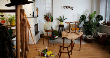 Rustic wooden furniture styled with modern fall décor, cozy layers, and natural autumn accents.