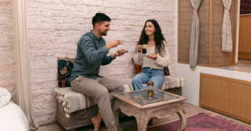A cozy living room styled with rustic wood furniture and soft textures, creating a warm and inviting end-of-year home atmosphere.