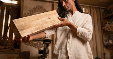 Handcrafted wooden table showcasing natural grain and artisanal details that bring warmth and character to a home.